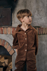 boy wearing brown corduroy set made of jacket and trousers