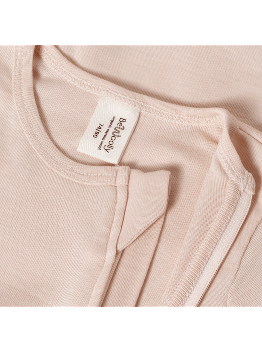 beige-neckline of a an overall made from silk and merino wool