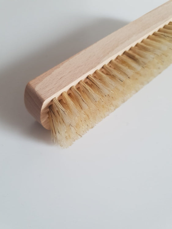Wooden brush with natural bristles