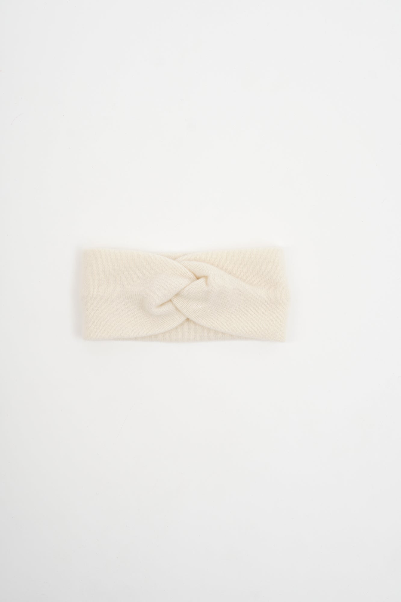 Cream-colored headband with a knot