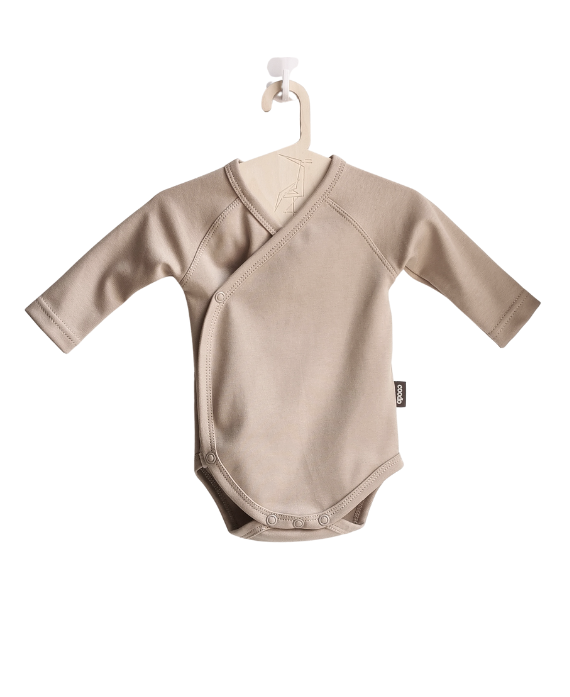 Organic, certified baby bodysuit kimono style in color beige on a white background