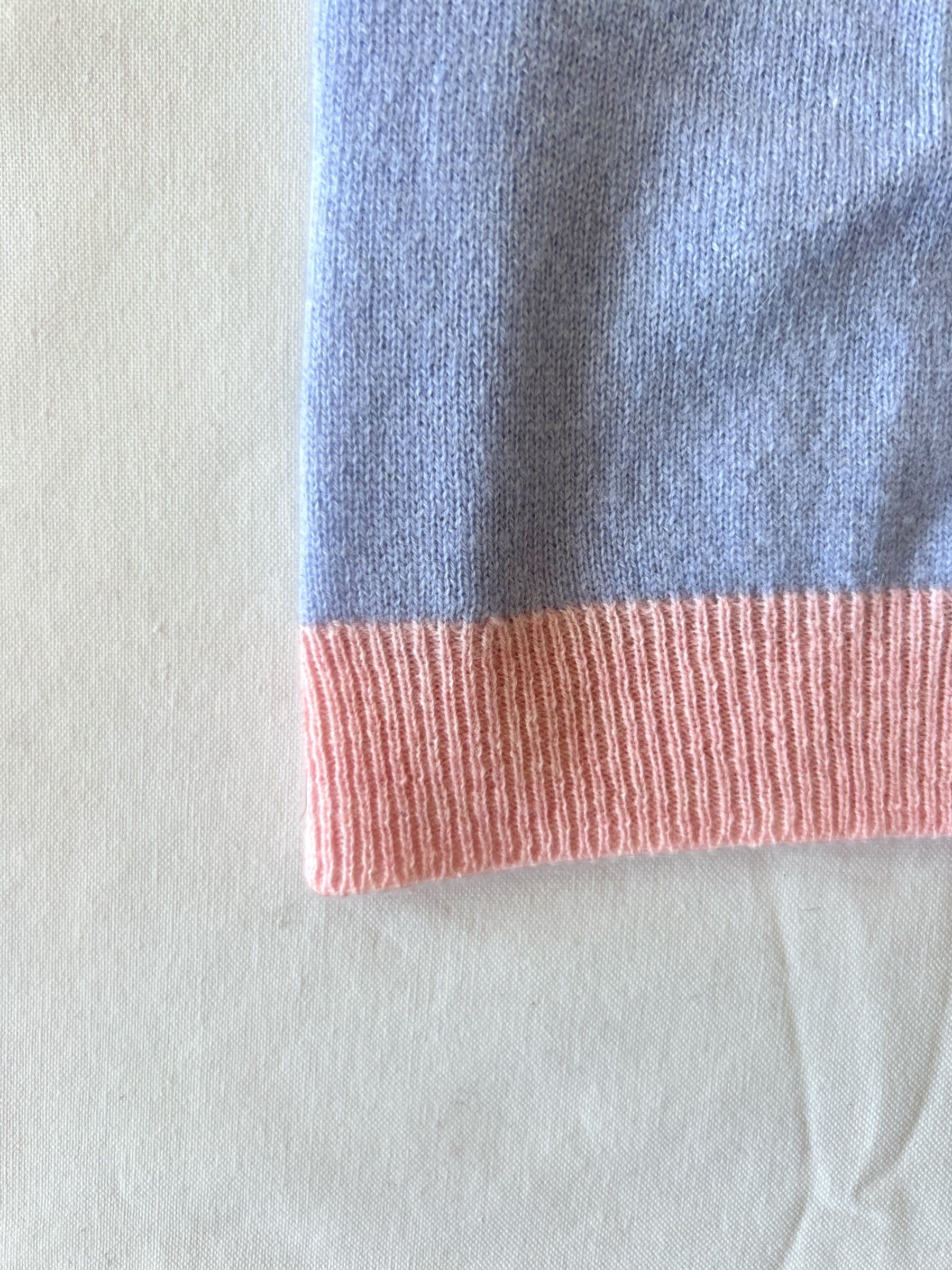 Close-up of a balaclava with blue and pink color block design