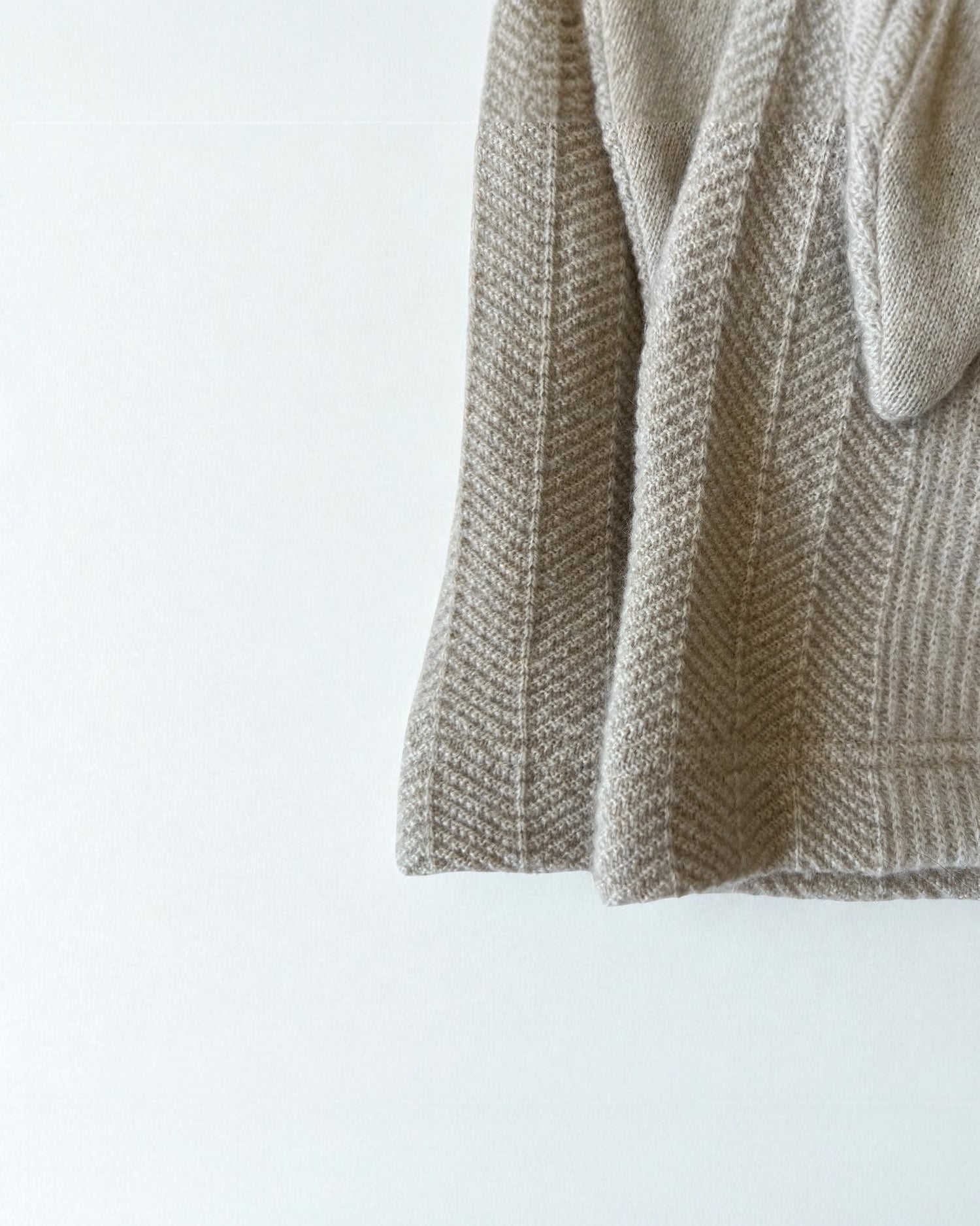 Close-up of a textured beige fabric on a white background