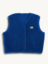 Blue merino wool vest on a white background