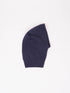 One folded dark blue beanie on a plain white background.