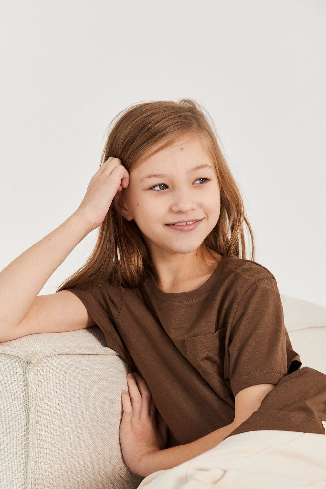 kiddies clothes tshirt in color braun on a young girl with long brown hair