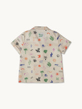 Short-sleeve shirt with colorful safari pattern on a white background
