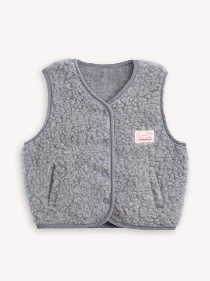 Gray merino wool vest with a brand label