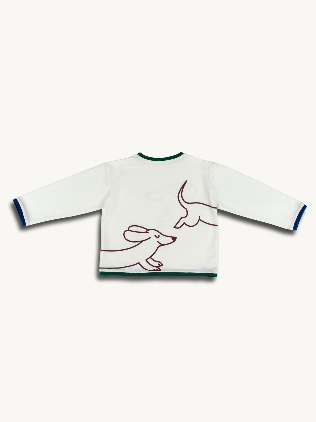 White sweater with line art of a dog on a white background