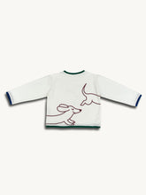 White sweater with line art of a dog on a white background