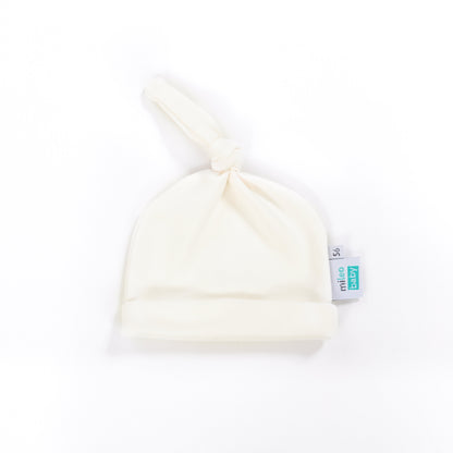 ecru newborn hat on a white background