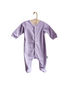 A lavender baby romper with feet on a white plain background