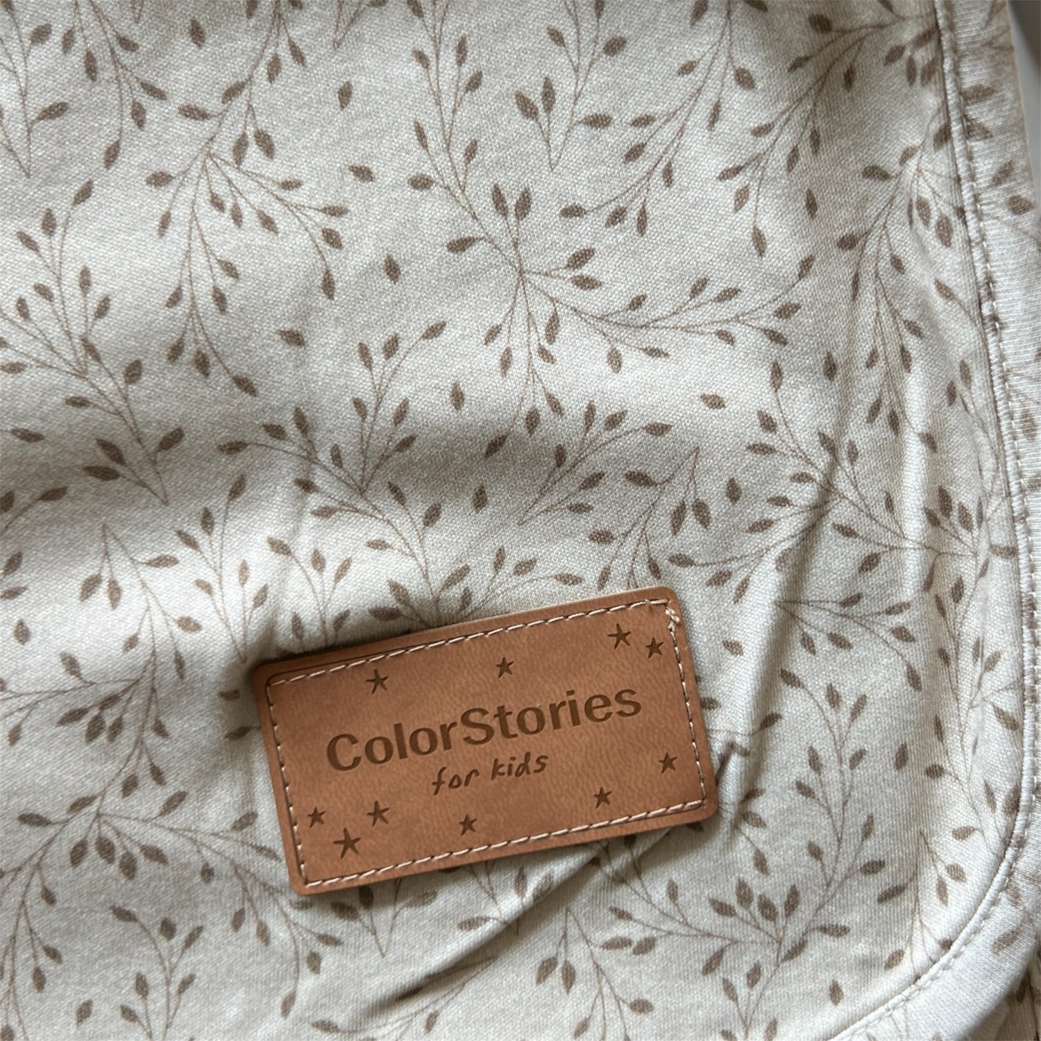 Brown leather label with &