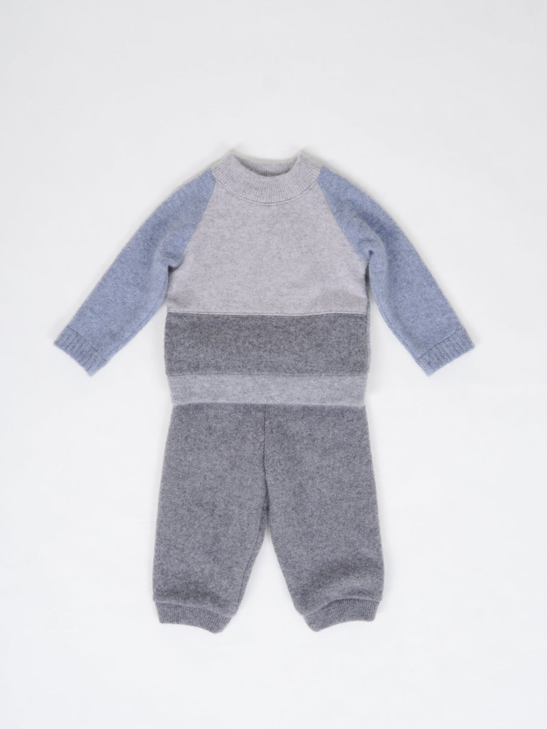 cashmere set of pants and sweater made of pure cashmere, perfect for newborn gift on the white background