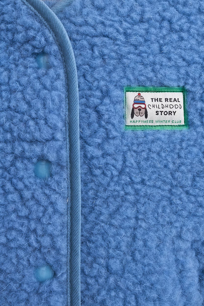 Close-up of a blue textured fabric with a label