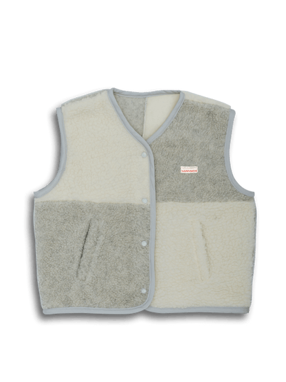 Two-tone vest with beige front and gray back on a black background